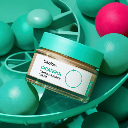 beplain Cicaterol Capsule Barrier Cream 50ml jar with teal lid surrounded by teal and pink decorative spheres