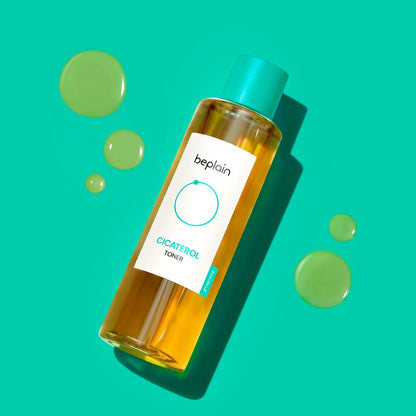 beplain Cicaterol Toner 200ml in clear amber bottle with teal cap and enhanced absorption formula droplets on turquoise background