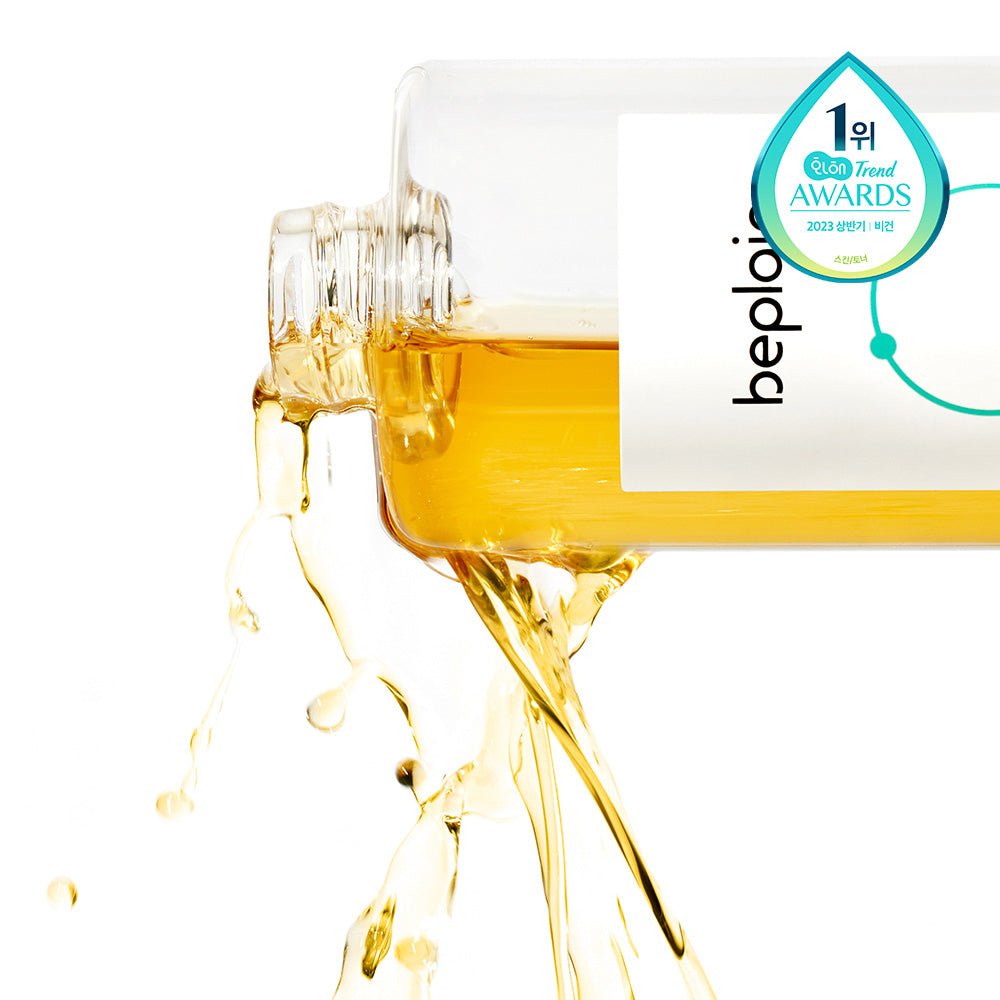 beplain Cicaterol Toner 200ml pouring golden liquid from clear bottle highlighting enhanced absorption formula