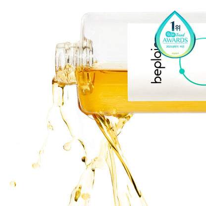 beplain Cicaterol Toner 200ml pouring golden liquid from clear bottle highlighting enhanced absorption formula