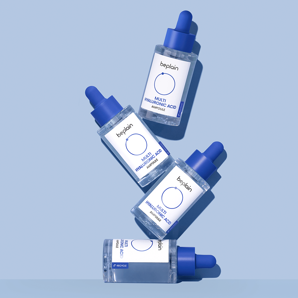 beplain Multi Hyaluronic Acid Ampoule 30ml bottles with blue droppers arranged on soft blue background for deep hydration benefits