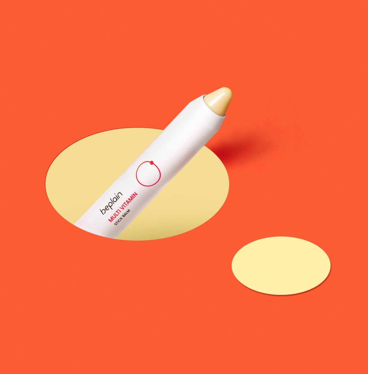 beplain Multi Vitamin Stick Balm 2.9g with creamy tip on vibrant orange background highlighting brightening effect