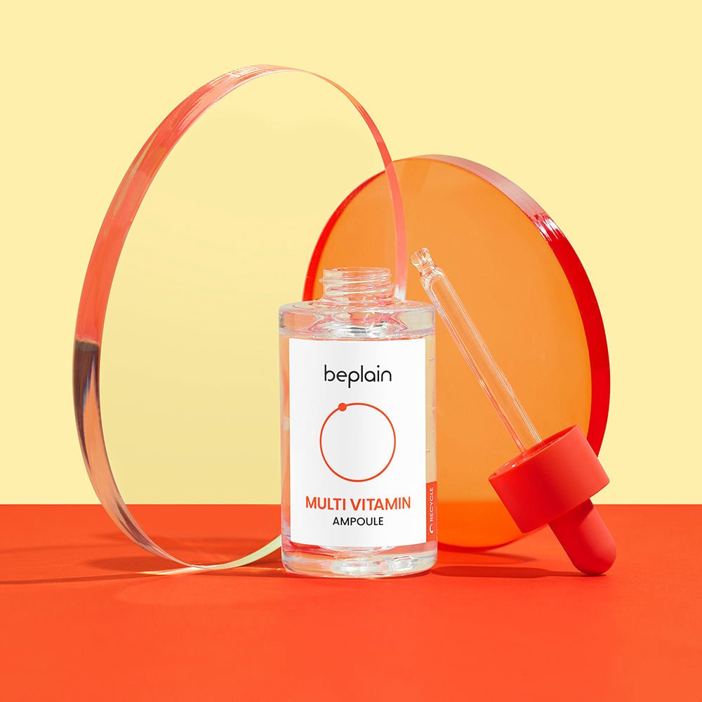beplain Multi-Vitamin Ampoule 30ml with clear serum and orange dropper cap, designed to revitalize skin appearance