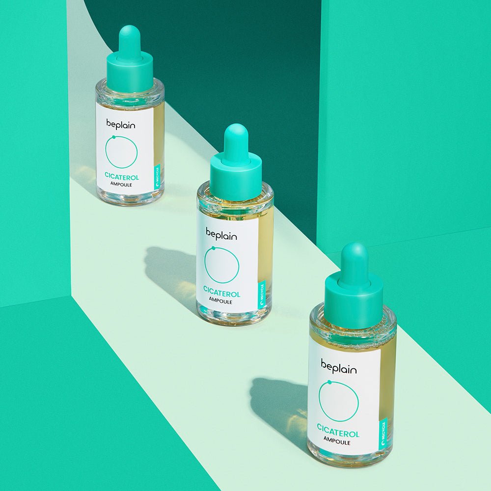 beplain Cicaterol Ampoule 30ml bottles with turquoise droppers arranged against vibrant teal and light green background highlighting soothing properties