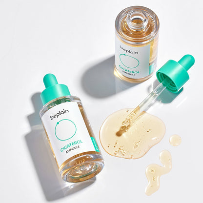 beplain Cicaterol Ampoule 30ml bottles with dropper and soothing serum spilled on white surface in soft light