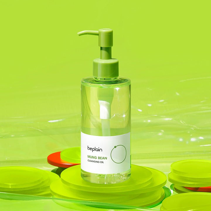 beplain Mung Bean Cleansing Oil 200ml in clear bottle with green pump for effective makeup removal against lime green background