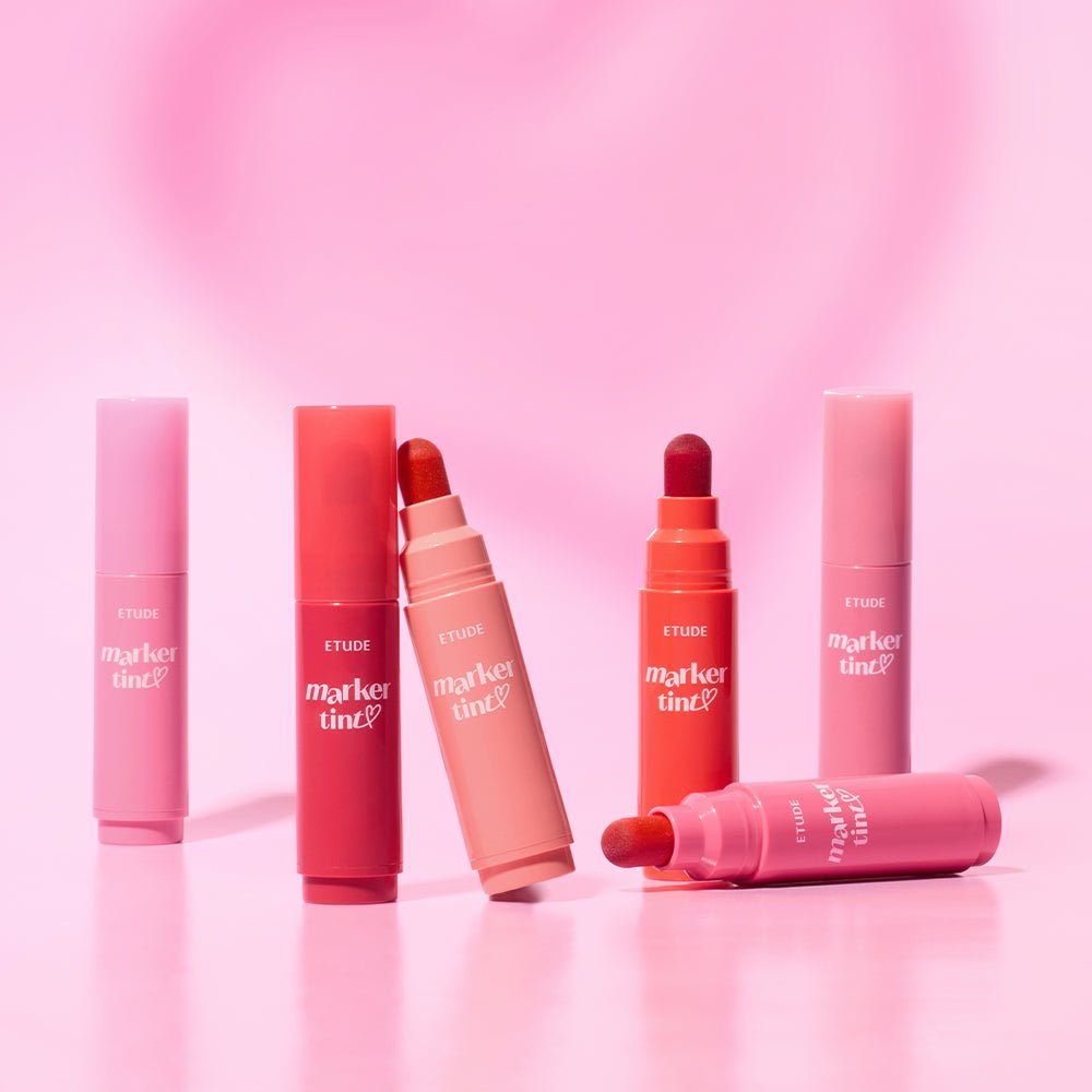 ETUDE Dear Darling Marker Tint 3.5g tubes in varied shades showcasing vivid color application on soft pink background