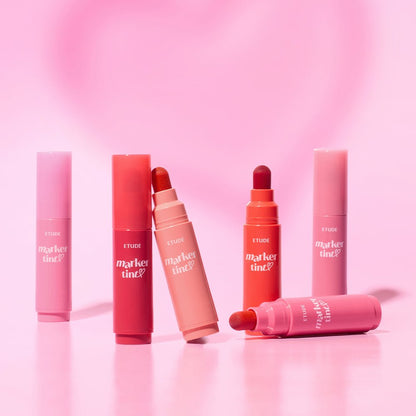 ETUDE Dear Darling Marker Tint 3.5g tubes in varied shades showcasing vivid color application on soft pink background