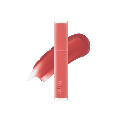ETUDE Fruity Dewy Tint 4.5g in coral shade with a hydration boost and smooth dewy finish swatch behind the tube