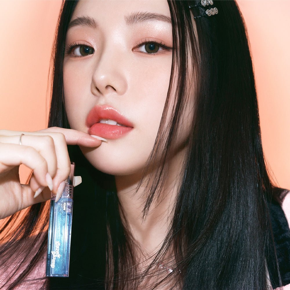 ETUDE Glaze Plump Gloss 4g applied on lips for a glossy, plump finish held by woman with long dark hair
