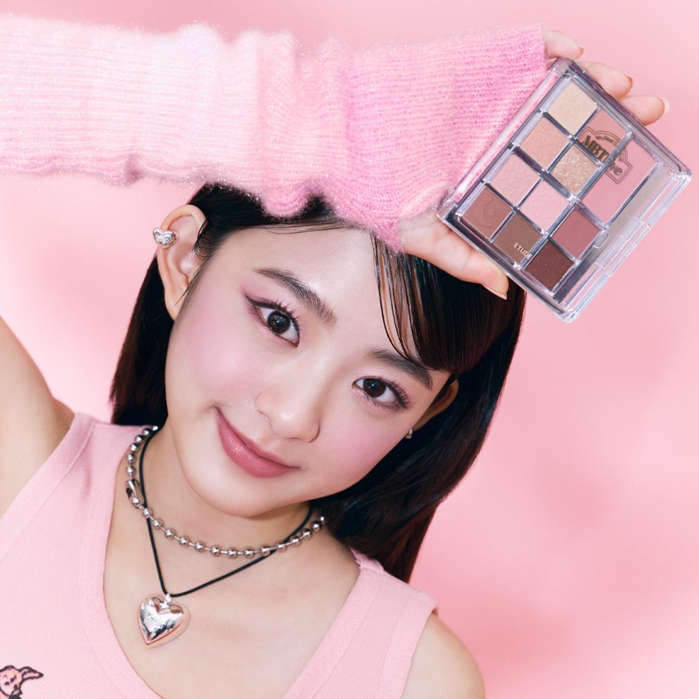 Young woman with soft pink makeup holding ETUDE My Best Tone Eye Palette showcasing diverse textures and tones