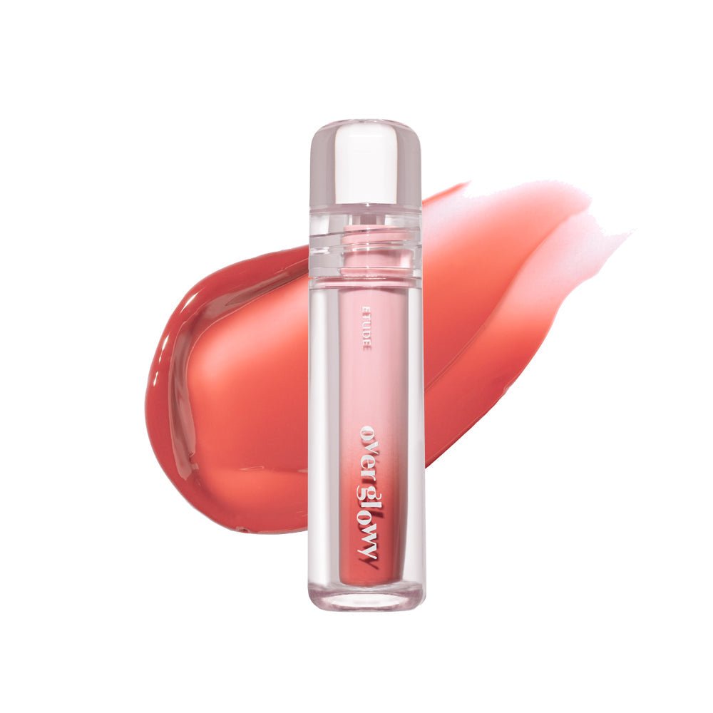 ETUDE Over Glowy Tint 3g in sleek clear tube with glossy high shine coral and peach swatches behind