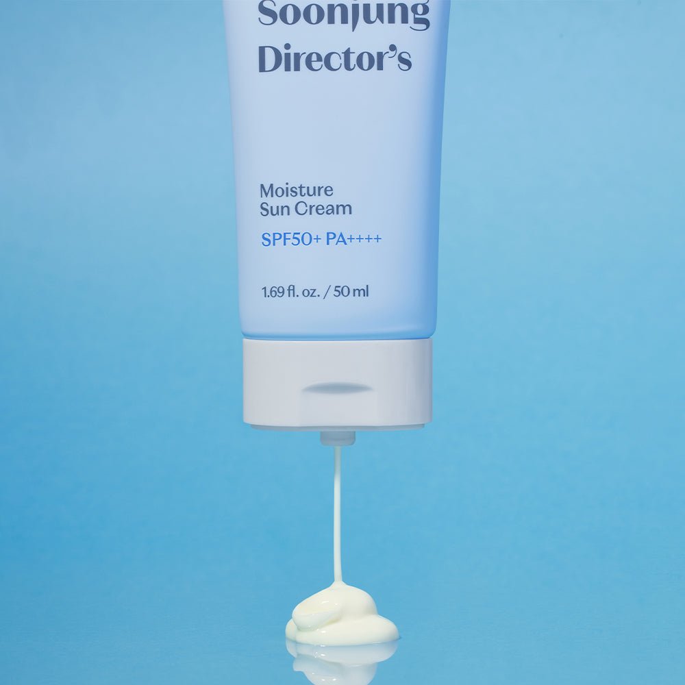 ETUDE Soonjung Director's Moisture Sun Cream SPF50+ PA++++, 50ml tube dispensing creamy white sunscreen on blue surface