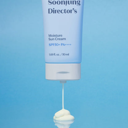ETUDE Soonjung Director's Moisture Sun Cream SPF50+ PA++++, 50ml tube dispensing creamy white sunscreen on blue surface