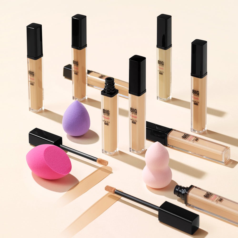ETUDE Big Cover Skin Fit Concealer PRO bottles in versatile shades with applicators and blending sponges on beige background