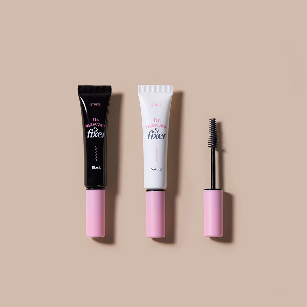 ETUDE Dr.Mascara Fixer 6g in black and natural tubes with pink caps and a wand applicator on beige background