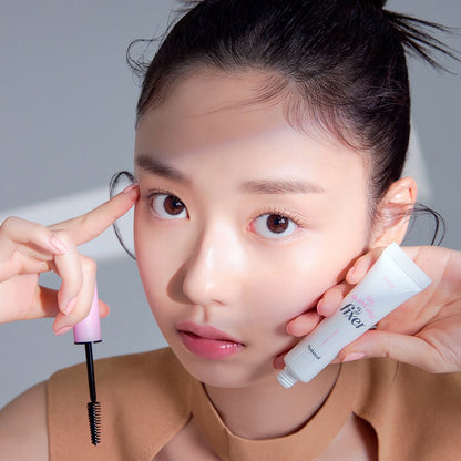 ETUDE Dr.Mascara Fixer 6g tube held by model with clean skin and focused expression for long-lasting hold