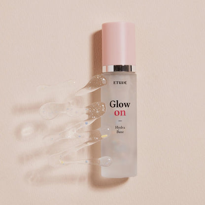 ETUDE Glow On Base Hydra 30ml bottle with clear hydrating gel droplets on beige background