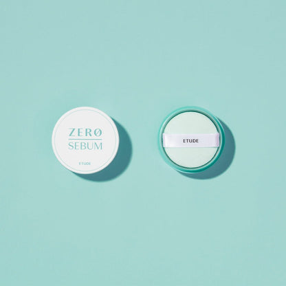 ETUDE Zero Sebum Drying Powder 4g with oil control formula in white compact and applicator on teal background