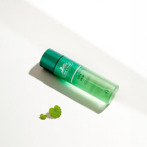 VT Cica Skin 200ml - VT Cosmetics in green bottle with soothing effect displayed against white background with green leaves