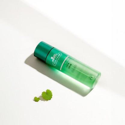 VT Cica Skin 200ml - VT Cosmetics in green bottle with soothing effect displayed against white background with green leaves
