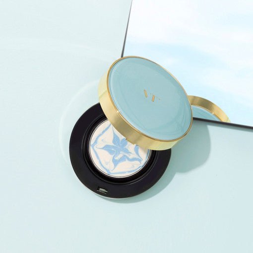 VT Essence Sun Pact SPF50+ PA+++ 11g in light blue and gold compact, offering effective UV protection for radiant skin.