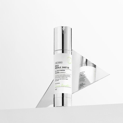 VT Mild Reedle Shot 50 50ml in white and silver bottle with pump dispenser enhanced for better absorption displayed with reflective surface