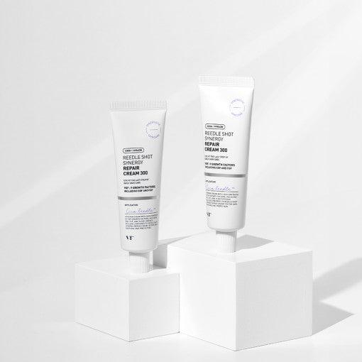 VT Reedle Shot Synergy Repair Cream 300 50ml tubes displayed on white blocks with sleek minimalist design and improved texture benefit