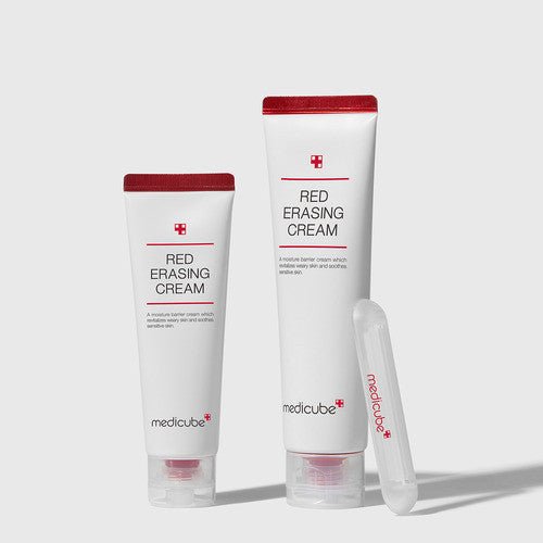 medicube Red Erasing Cream 50ml tubes with red caps standing next to clear applicator on light background