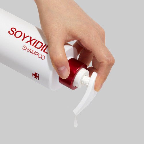 medicube Soyxidil Shampoo 490ml with red pump dispensing clear liquid for hair loss prevention care