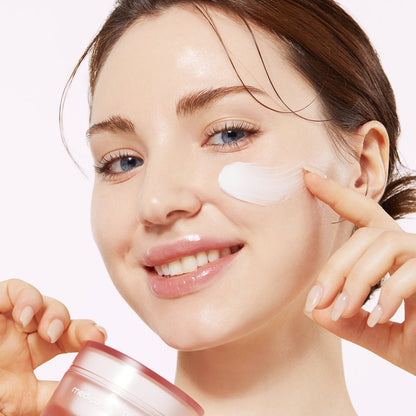 medicube Triple Collagen Cream 50ml applied on cheek by smiling woman highlighting improved elasticity benefits