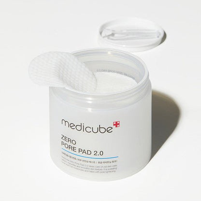 medicube Zero Pore Pad 2.0 container open with textured white pad showing pore tightening skincare solution