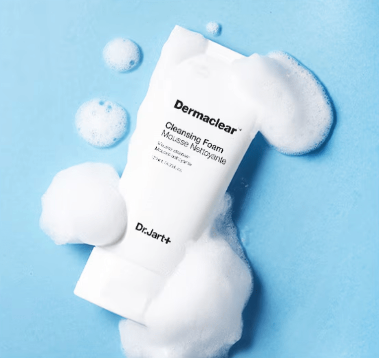 Dr.Jart+ Dermaclear Cleansing Foam 120ml tube surrounded by gentle white foam on a soft blue background