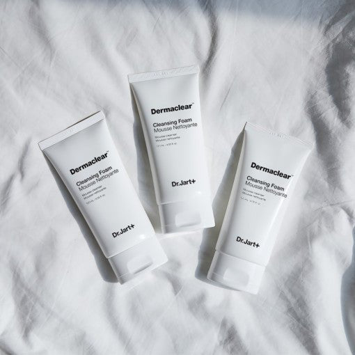 Dr.Jart+ Dermaclear Cleansing Foam 120ml tubes arranged on white fabric highlighting gentle purification formula