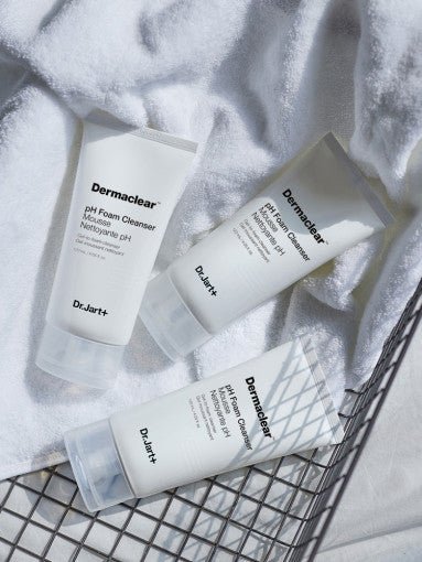 Dr.Jart+ Dermaclear pH Foam Cleanser 120ml tubes arranged on white textured fabric for thorough cleansing