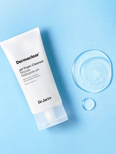 Dr.Jart+ Dermaclear pH Foam Cleanser 120ml tube with clear cleansing gel drops on blue background