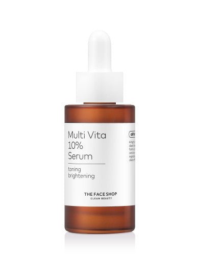 Amber dropper bottle of brightening serum with white label and minimalist text on a white background
