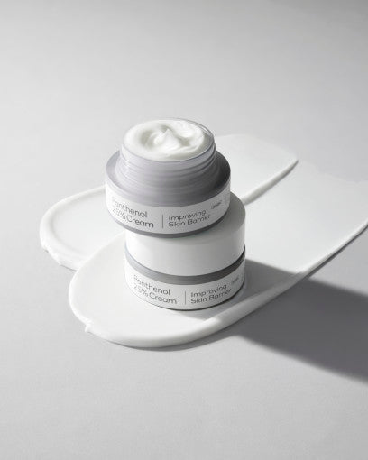 Open jar of hydrating cream with smooth white texture on light surface highlighting skin barrier benefits