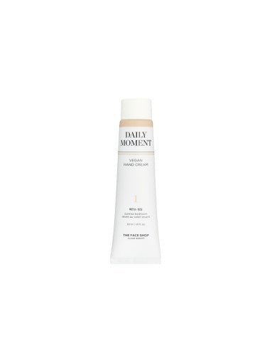 Slim white tube of Daily Moment vegan hand cream with minimalist label design and beige cap on white background