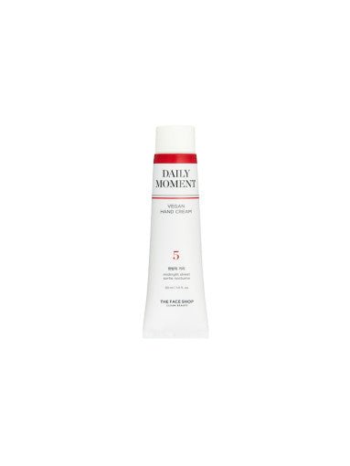 Slim white tube of vegan hand cream with red band and simple text highlighting long-lasting moisture benefits