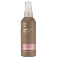 Matte brown bottle of hair mist with clear spray cap labeled for essential damage care and moisture retention benefits
