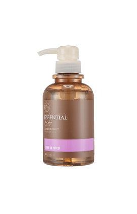 Translucent brown pump bottle of Essential Style Up hair gel with pink label band on white background