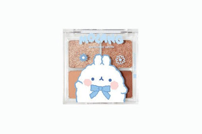 Compact eyeshadow palette featuring four warm shades with cute cartoon character design on the lid