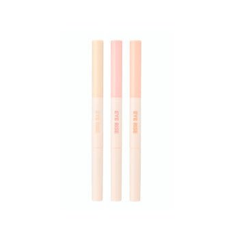 Three slim dual-ended under eye makers in pastel peach and pink shades with subtle branding on pale tubes