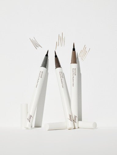 Three brush tip liners with natural finish strokes on white surface showcasing precise fine lines