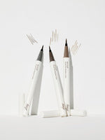 Three brush tip liners with natural finish swatches on white background showing fine precise strokes