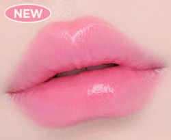 Close-up of lips wearing soft pink lipstick with a semi-gloss finish highlighting smooth, hydrated texture
