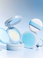 Open compact with swirled moisturizing sun pact cream and closed blue case paired with white puff labeled "the therapy