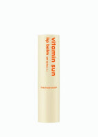Cream-colored lip balm tube with orange text highlighting sun protection and vibrant color benefits on white background