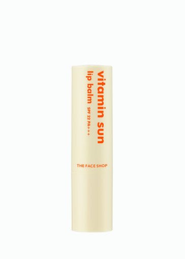 Slim beige lip balm tube labeled vitamin sun with SPF 22 PA+++ in bright orange text on white background